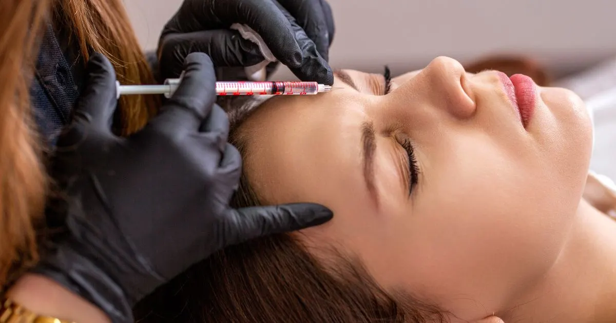 professional preparing a syringe for HA dermal filler injection to restore facial volume and provide natural rejuvenation.